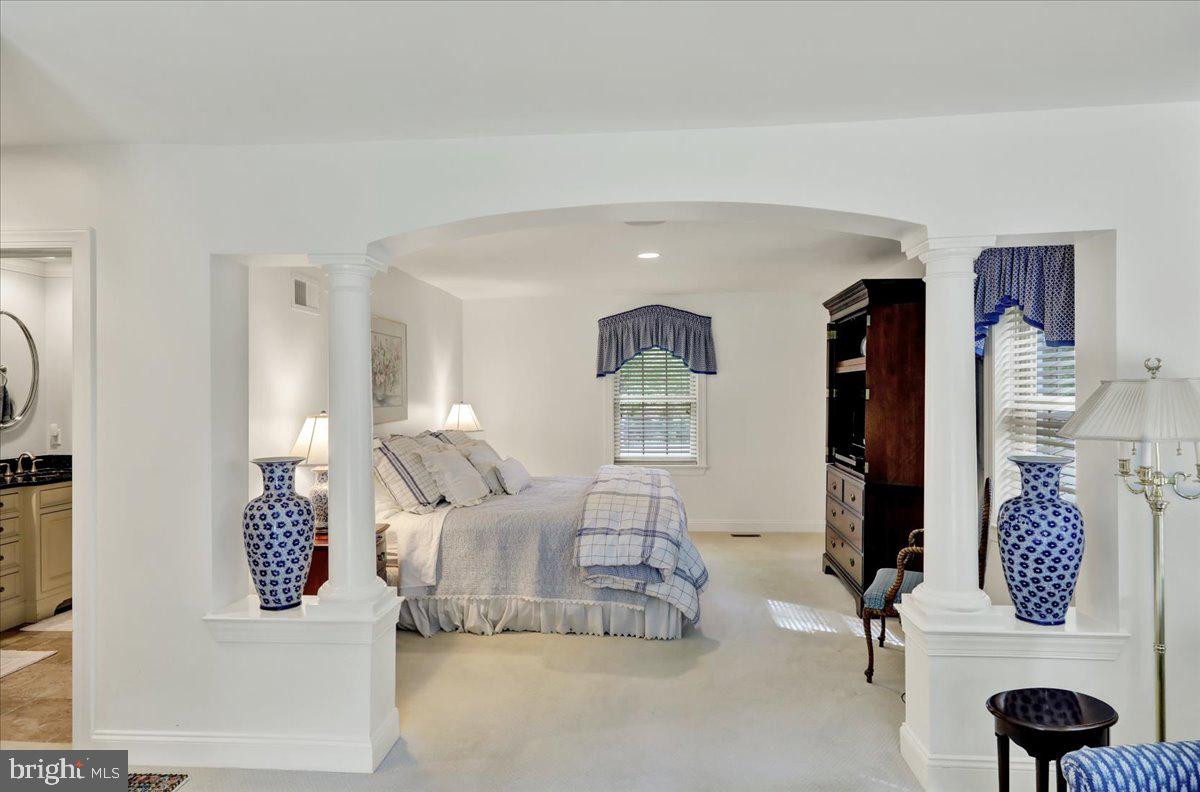 2 Cardinal Road Wyomissing, PA 19610 - Photo 32 of 51 a bedroom with furniture and a mirror