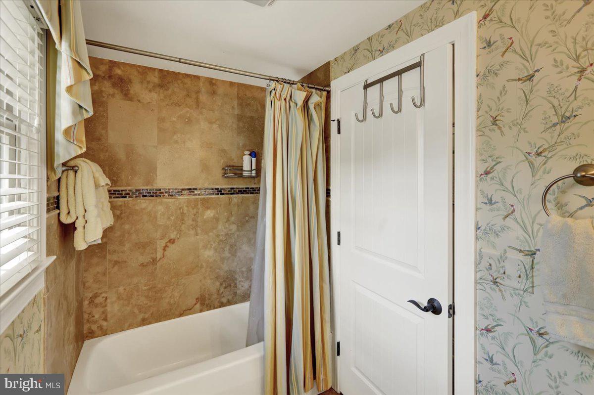 2 Cardinal Road Wyomissing, PA 19610 - Photo 38 of 51 a bathroom with a shower and a glass door