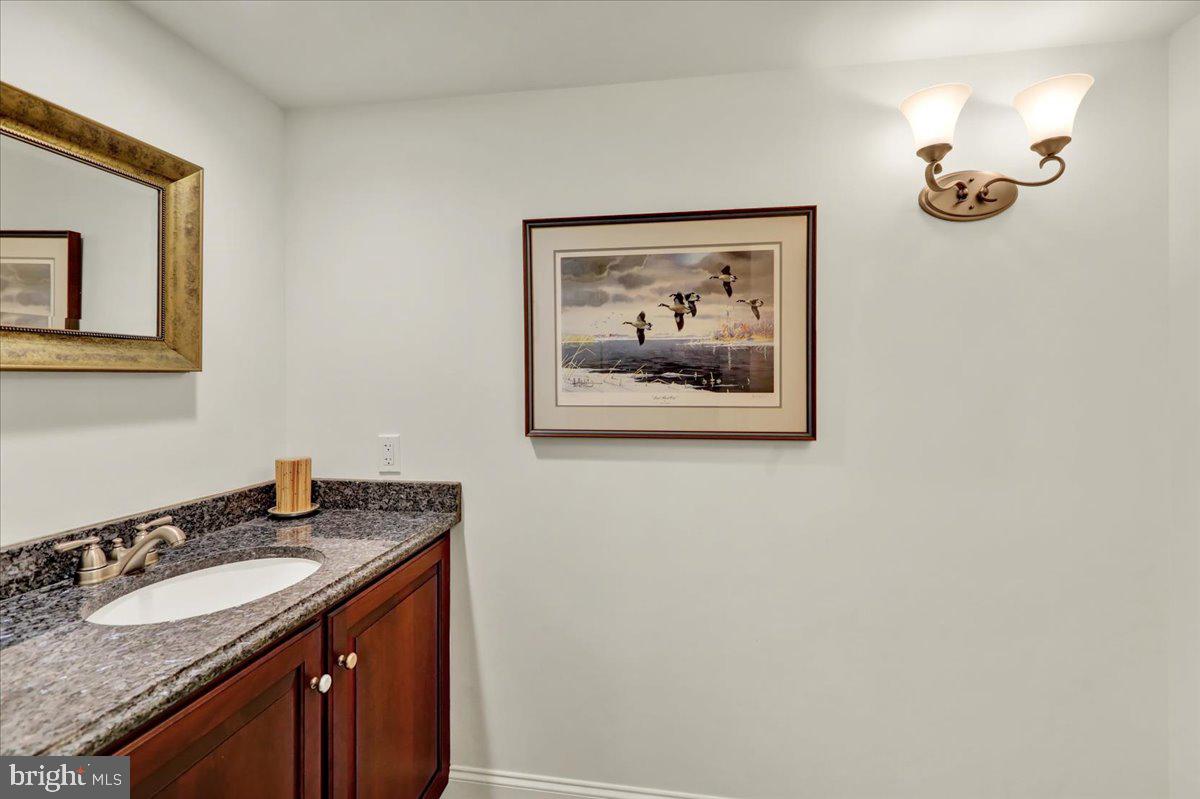 2 Cardinal Road Wyomissing, PA 19610 - Photo 43 of 51 a bathroom with a sink and a mirror