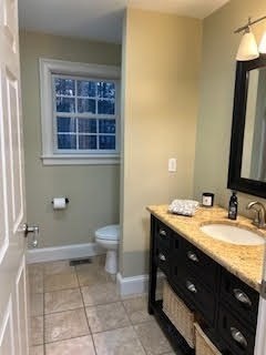 73 Bennett Road Hampden, MA 01036 - Photo 8 of 10 a bathroom with a granite countertop sink a toilet and a mirror