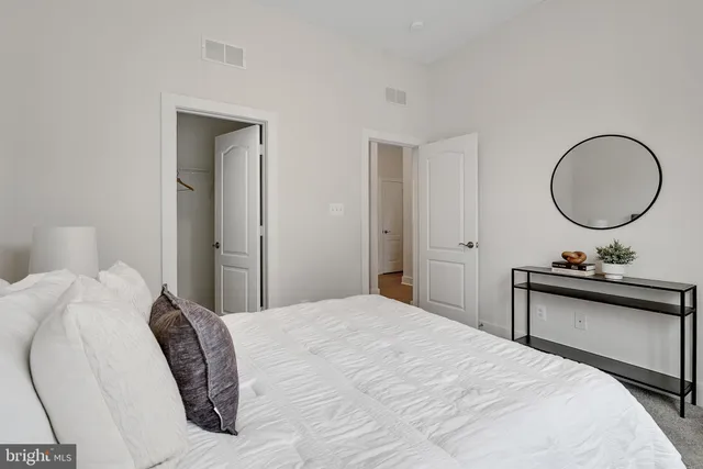 a bedroom with a bed and a fish aquarium