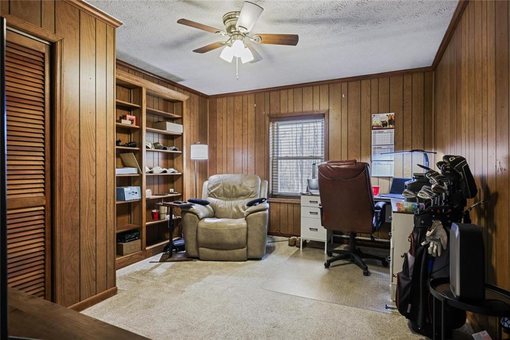4505 Cochran Mill Road Fairburn, GA 30213 - Photo 19 of 36 a view of a workspace with furniture and a window