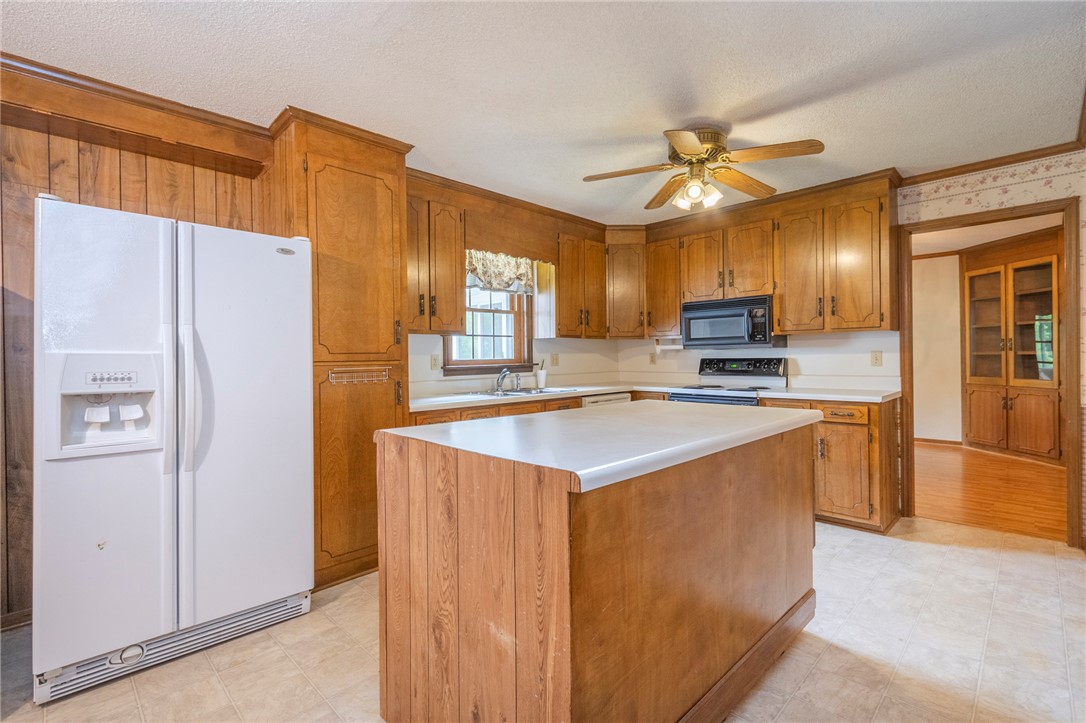 1116 Leatherdale Road Iva, SC 29655 - Photo 25 of 46 This spacious kitchen offers ample cabinetry, a functional island, and convenient modern appliances.