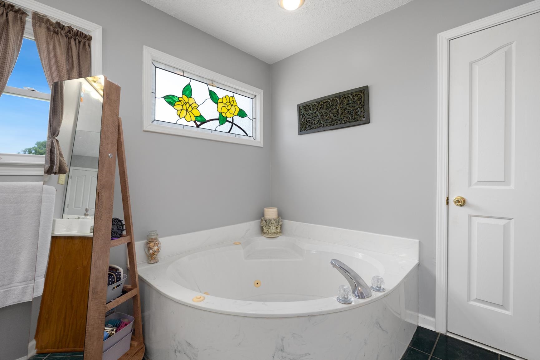 8539 Campground Road Drummonds, TN 38023 - Photo 21 of 38 a bathroom with a tub and sink