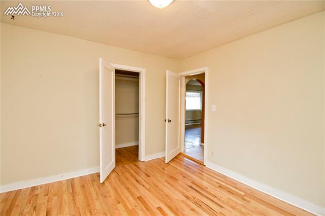 1132 Alexander Road Colorado Springs, CO 80909 - Photo 16 of 25 Second bedroom with walk-in closet