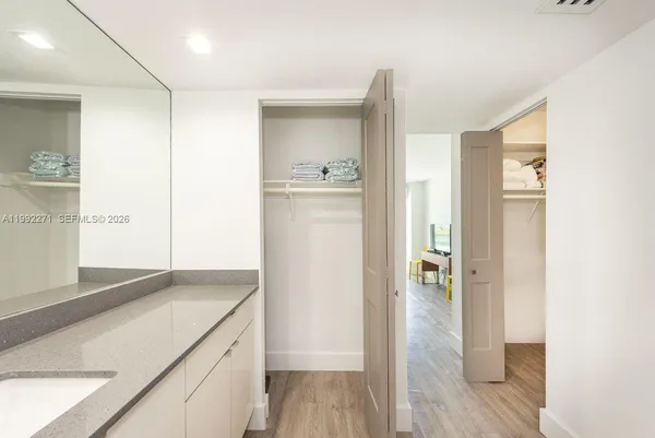 a bathroom with a shower and a sink