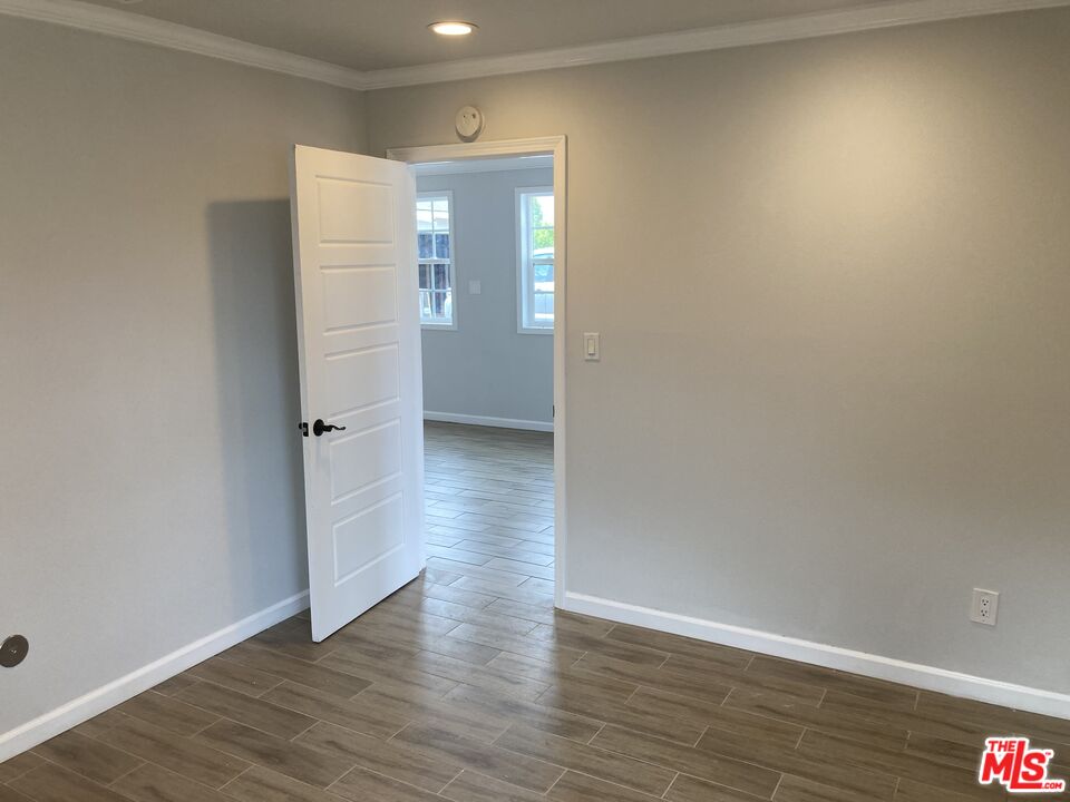 903 Arnold Drive Placentia, CA 92870 - Photo 6 of 11 a view of empty room with wooden floor