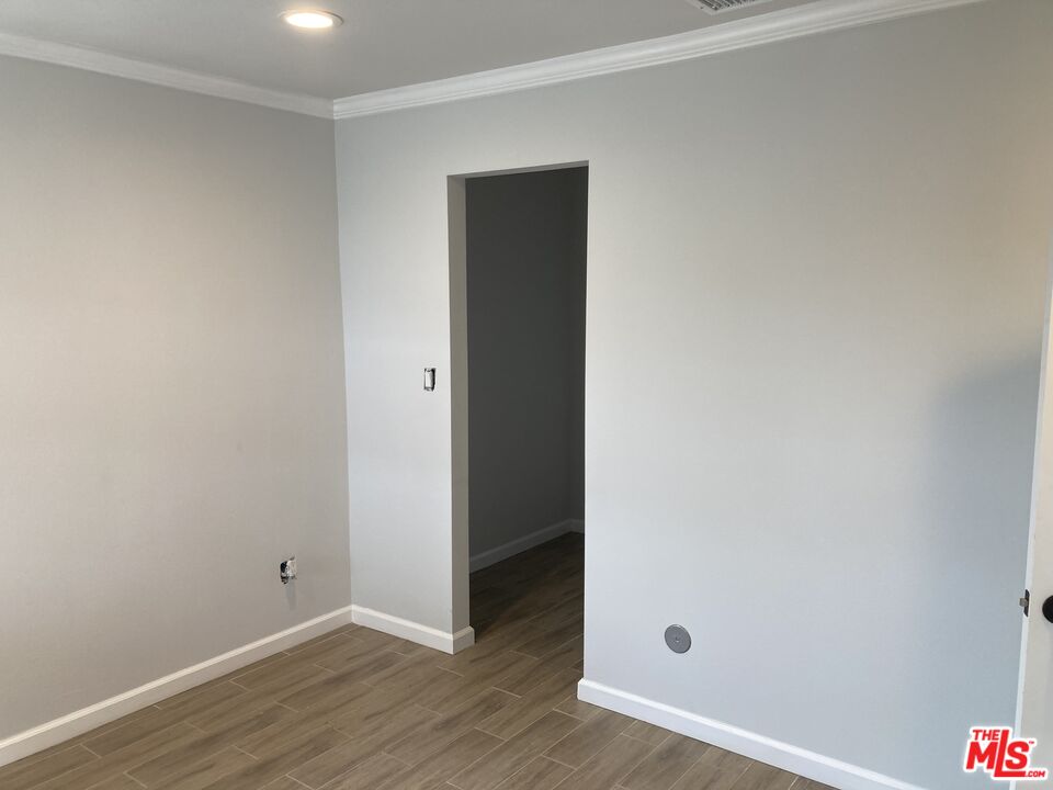 903 Arnold Drive Placentia, CA 92870 - Photo 9 of 11 a view of an empty room with wooden floor
