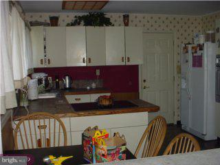 29 Fieldstone Road Levittown, PA 19056 - Photo 2 of 6 a kitchen with a refrigerator and a sink