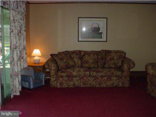 29 Fieldstone Road Levittown, PA 19056 - Photo 6 of 6 a living room with furniture and a fireplace