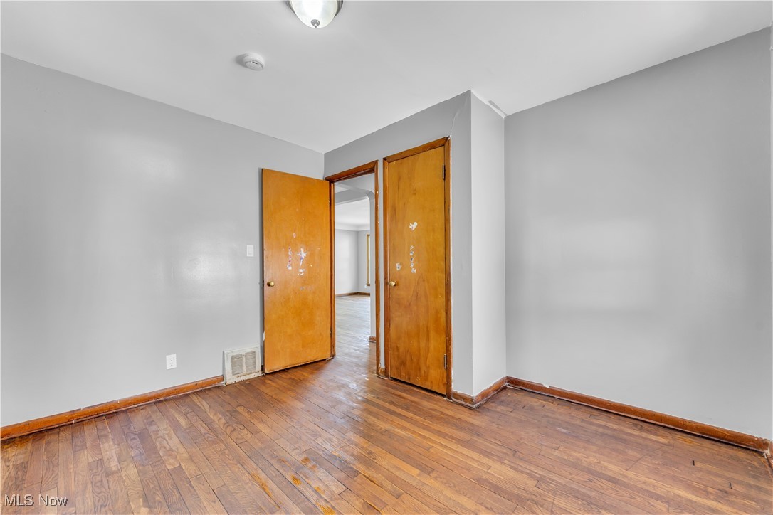 5817 Turney Road Garfield Heights, OH 44125 - Photo 18 of 31 Empty room with hardwood / wood-style flooring