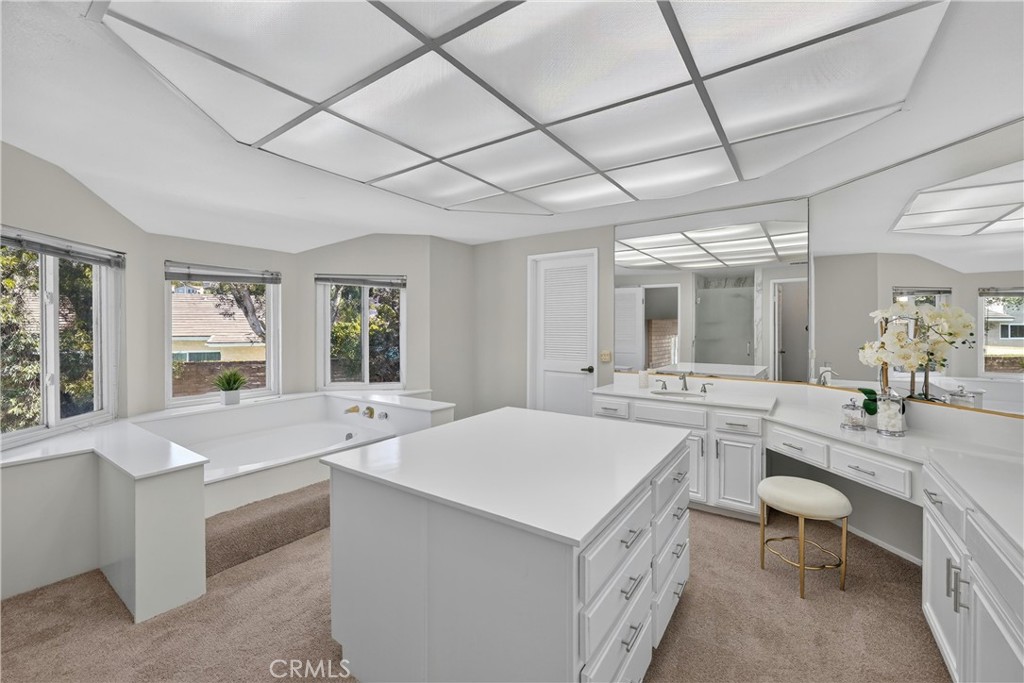 2935 Bluebell Avenue Brea, CA 92821 - Photo 21 of 38 Primary bathroom includes a walk-in shower, dual sinks, dedicated vanity space, and a spacious walk-in closet, creating a comfortable private retreat