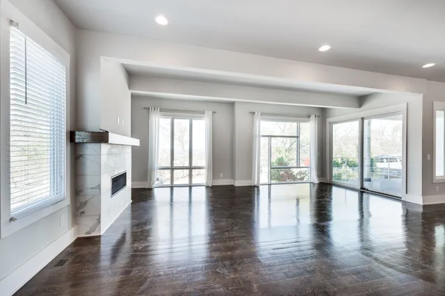 a view of kitchen with furniture and wooden floor