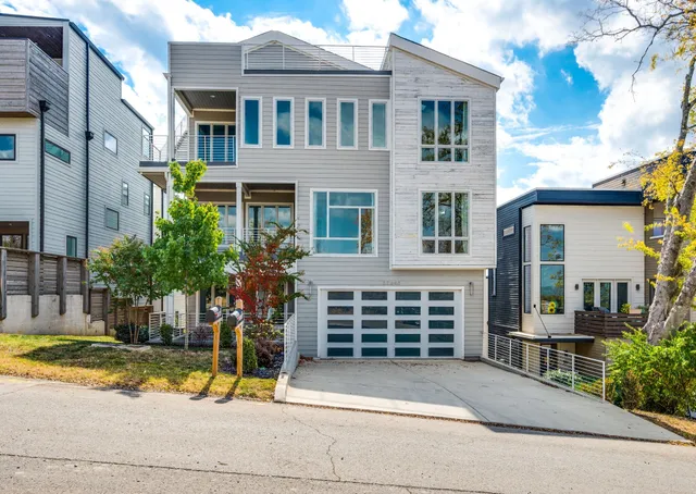 a front view of a house with a garage