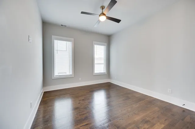 a bathroom with a bathtub shower sink and mirror