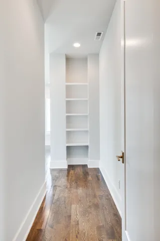 a bathroom with a bathtub sink and mirror
