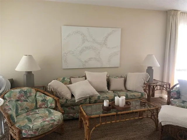 a living room with furniture and a lamp