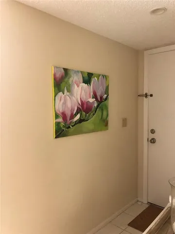 a room with a painting on the wall