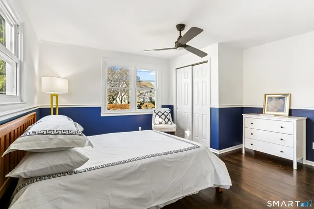 a bedroom with a bed and a table