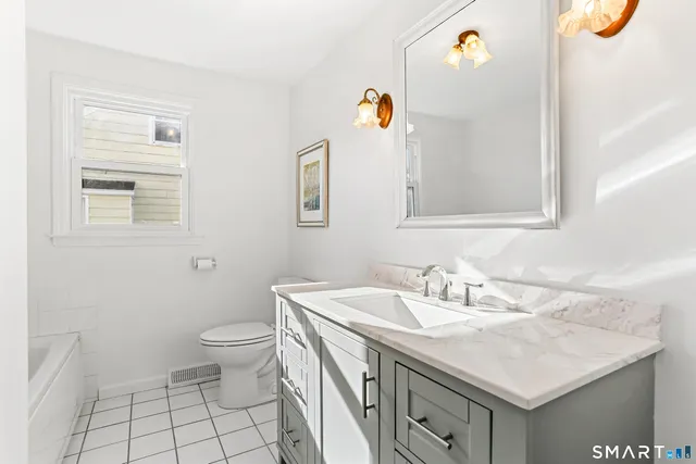 a bathroom with a sink and a toilet