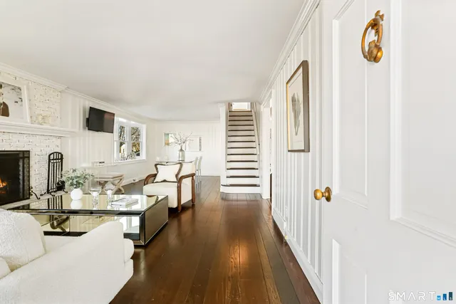 a dining room with furniture and a fireplace