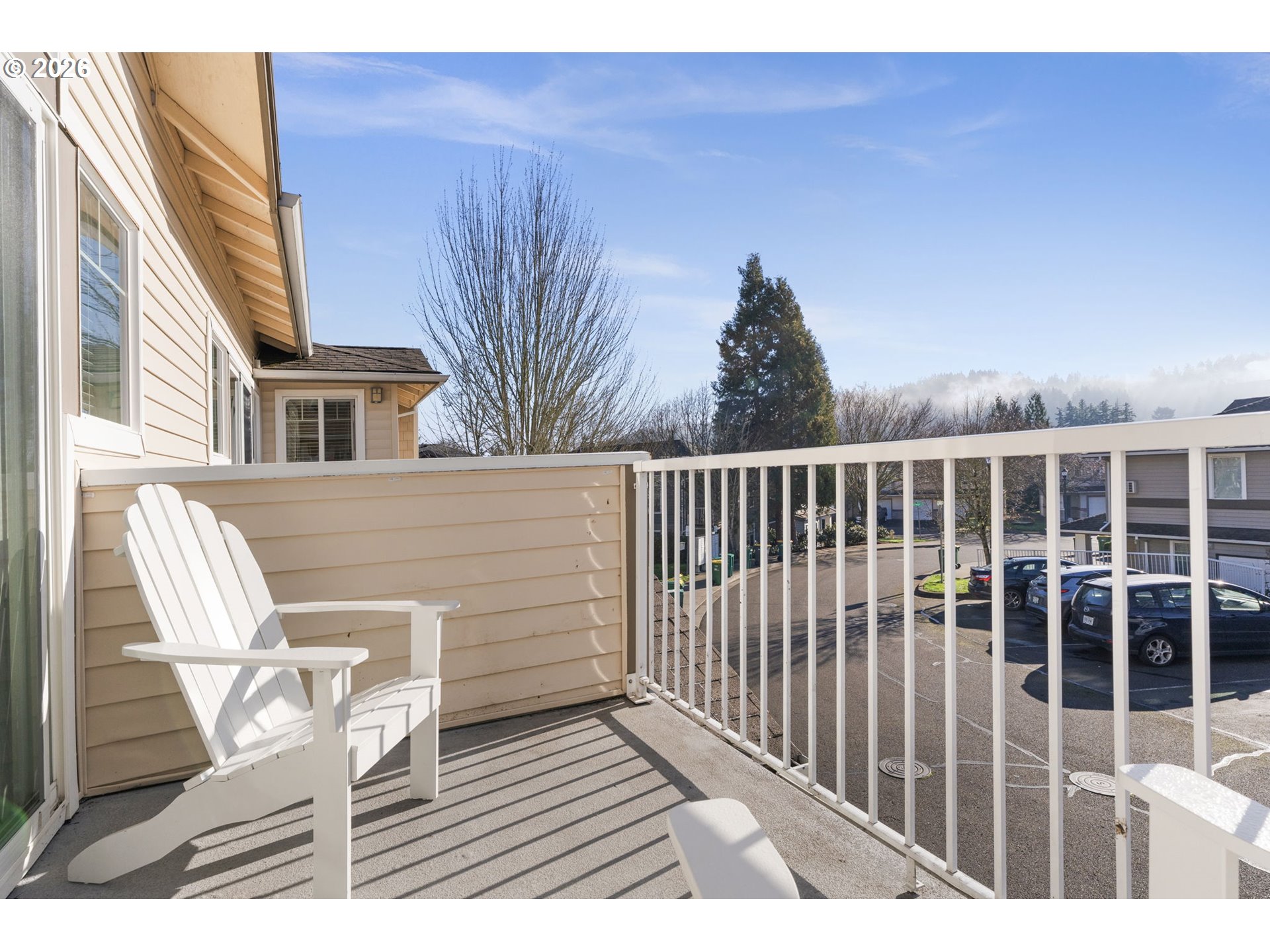 14705 Southwest Sandhill Loop, Unit 202 Beaverton, OR 97007 - Photo 18 of 24 a view of a chair and table in the balcony
