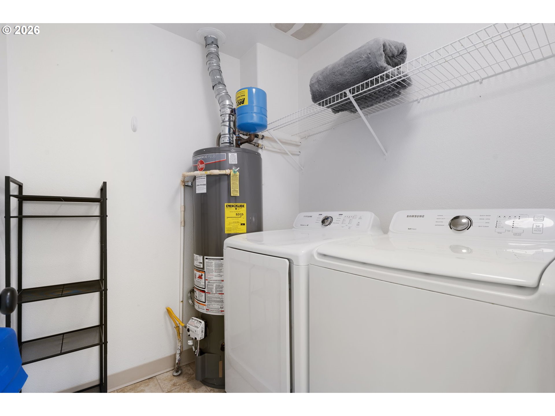 14705 Southwest Sandhill Loop, Unit 202 Beaverton, OR 97007 - Photo 19 of 24 a utility room with dryer and washer