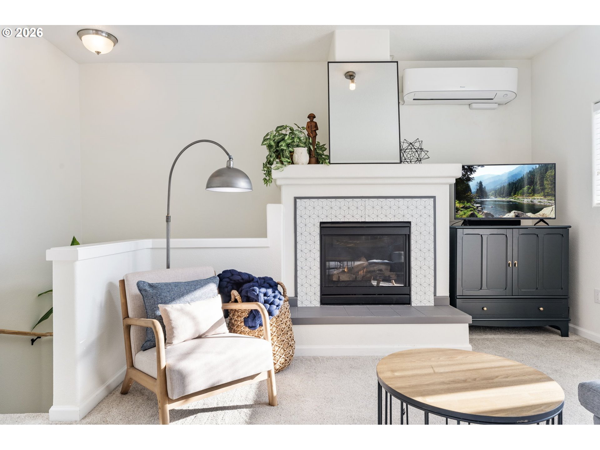 14705 Southwest Sandhill Loop, Unit 202 Beaverton, OR 97007 - Photo 3 of 24 a living room with furniture and a fireplace