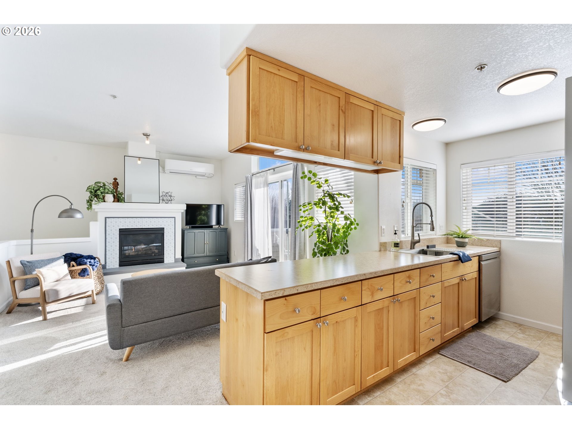 14705 Southwest Sandhill Loop, Unit 202 Beaverton, OR 97007 - Photo 7 of 24 a kitchen with stainless steel appliances granite countertop a stove a sink and a refrigerator