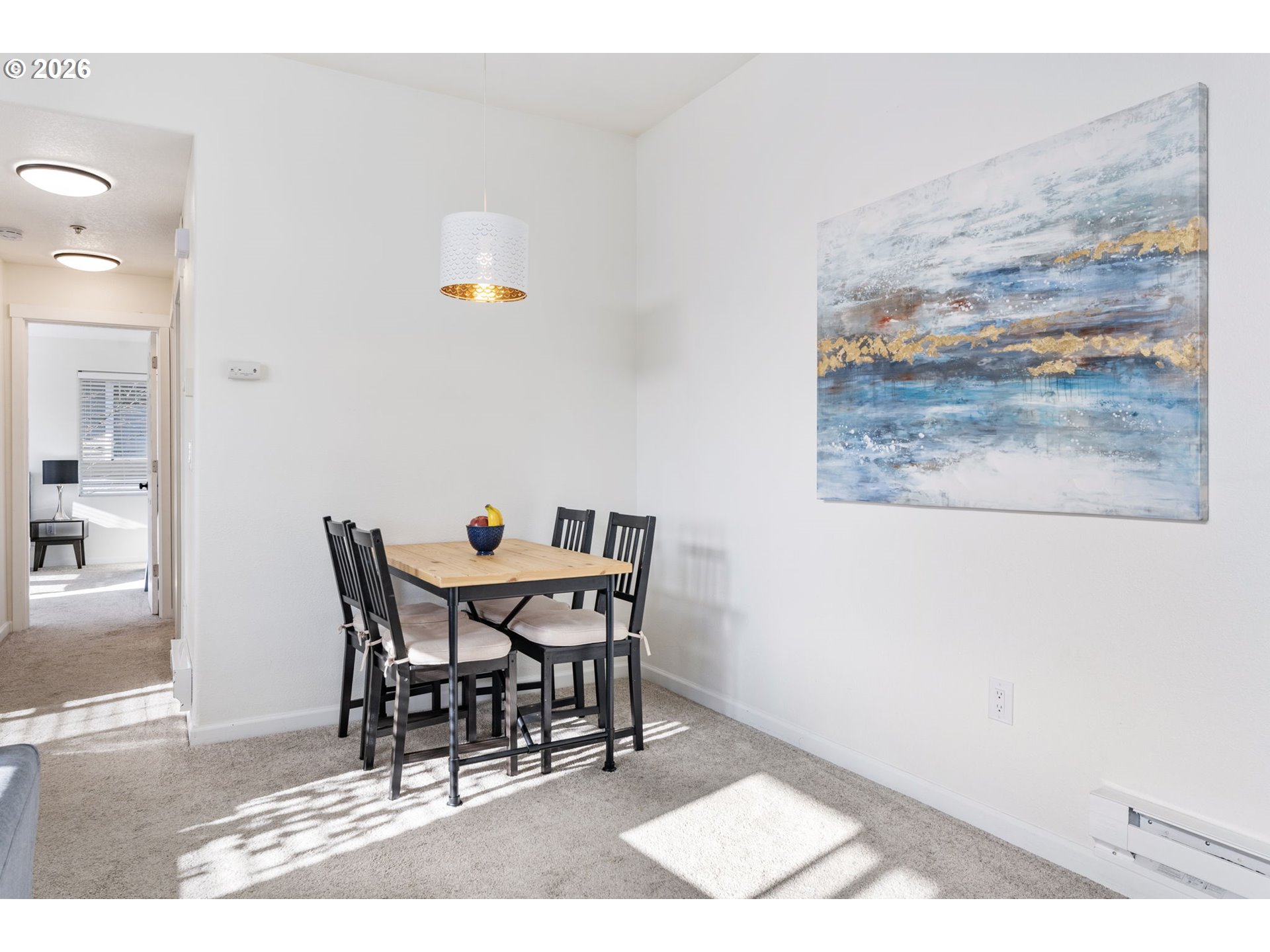 14705 Southwest Sandhill Loop, Unit 202 Beaverton, OR 97007 - Photo 10 of 24 a dining room with furniture and wooden floor