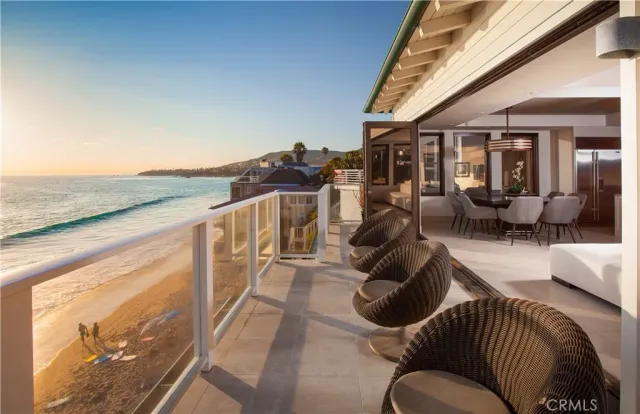a large bed sitting in a bedroom next to a large window
