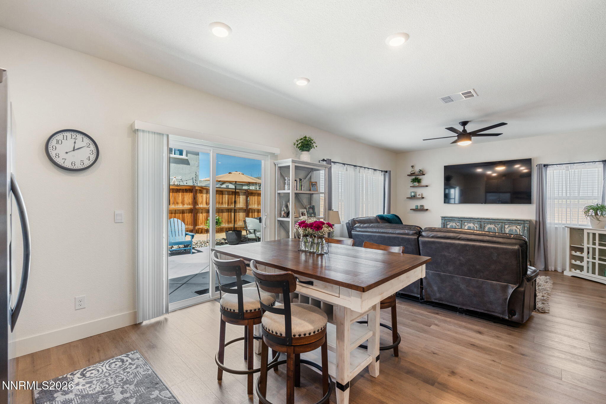 7999 Majorite Way Sparks, NV 89436 - Photo 13 of 26 a living room with furniture and a flat screen tv