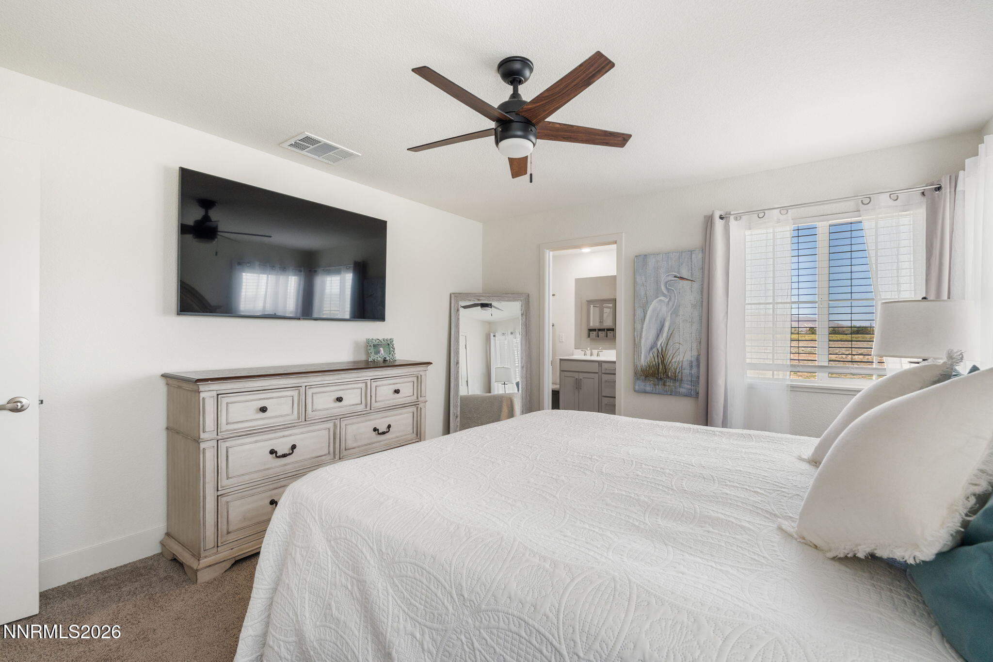 7999 Majorite Way Sparks, NV 89436 - Photo 17 of 26 a bedroom with a bed and a flat screen tv