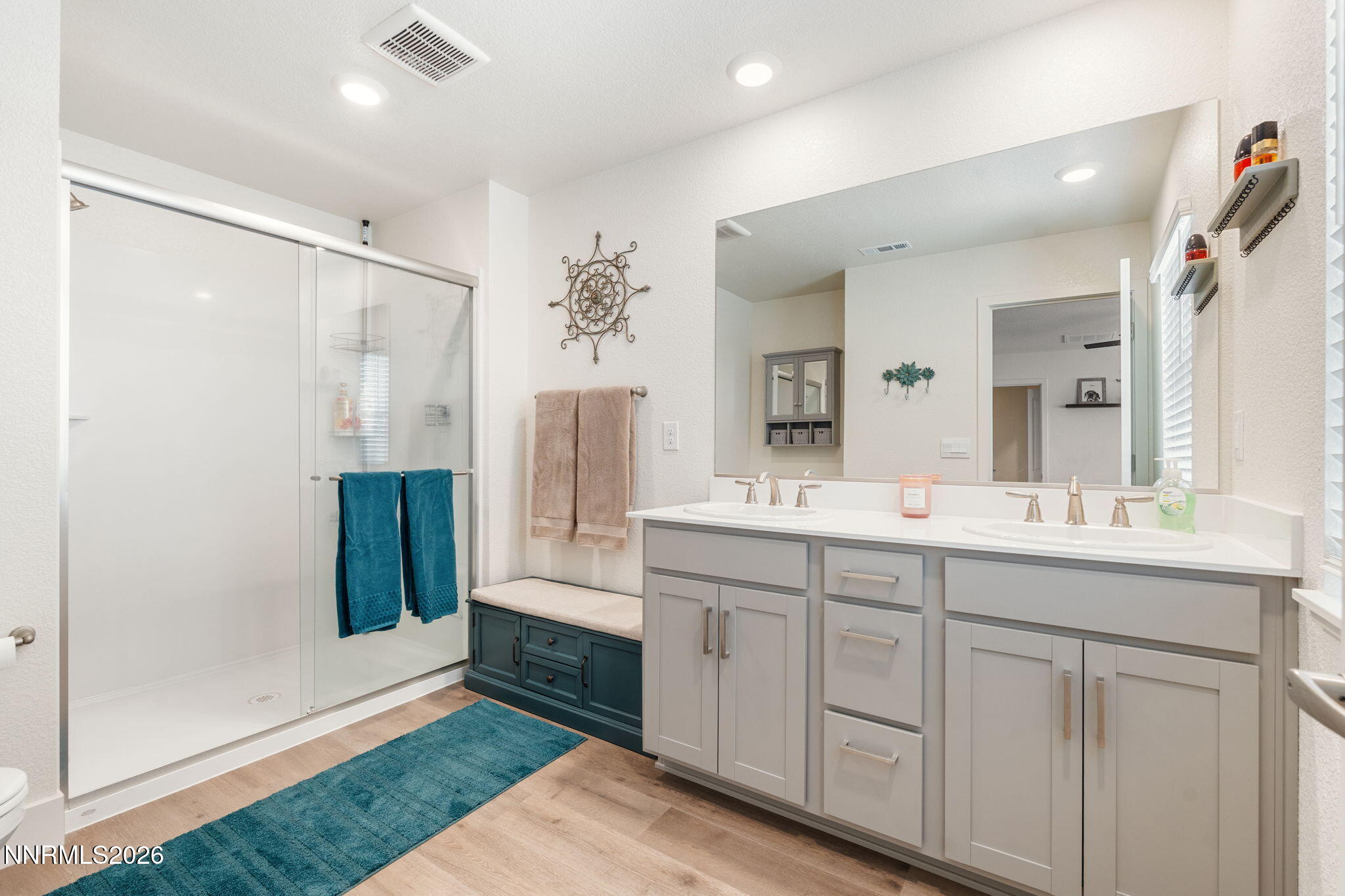 7999 Majorite Way Sparks, NV 89436 - Photo 18 of 26 a bathroom with a double vanity sink and mirror