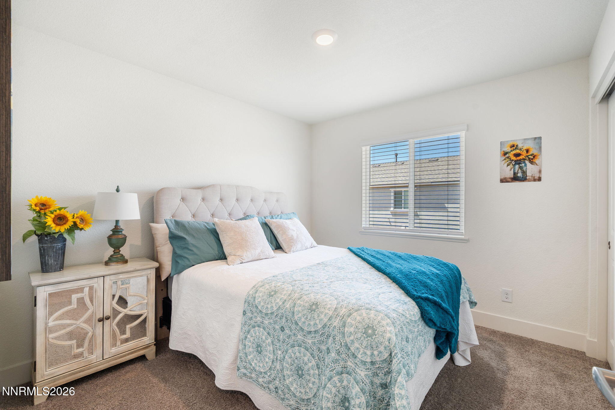 7999 Majorite Way Sparks, NV 89436 - Photo 19 of 26 a bedroom with a bed and a window