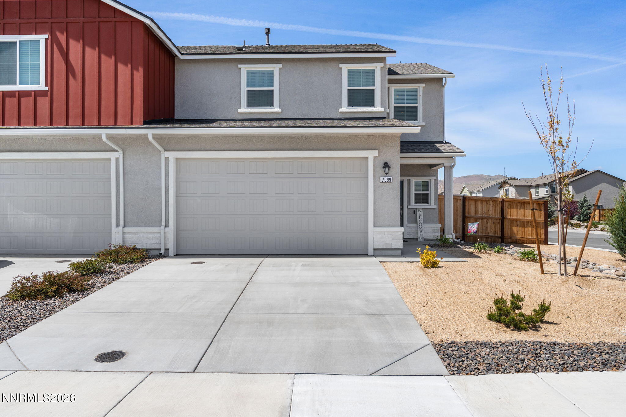 7999 Majorite Way Sparks, NV 89436 - Photo 2 of 26 a front view of a house with a yard
