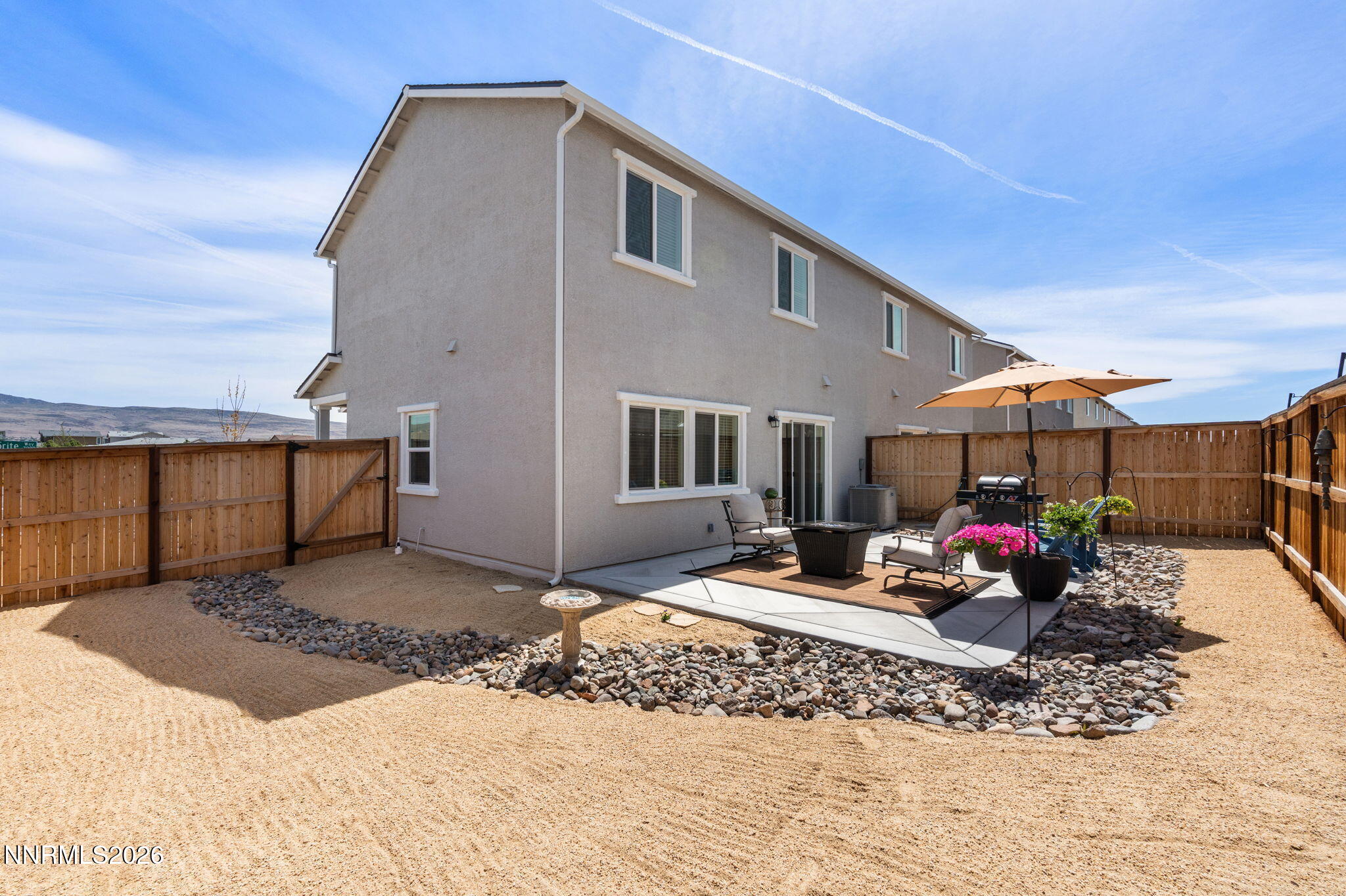 7999 Majorite Way Sparks, NV 89436 - Photo 24 of 26 a front view of a house with a couch