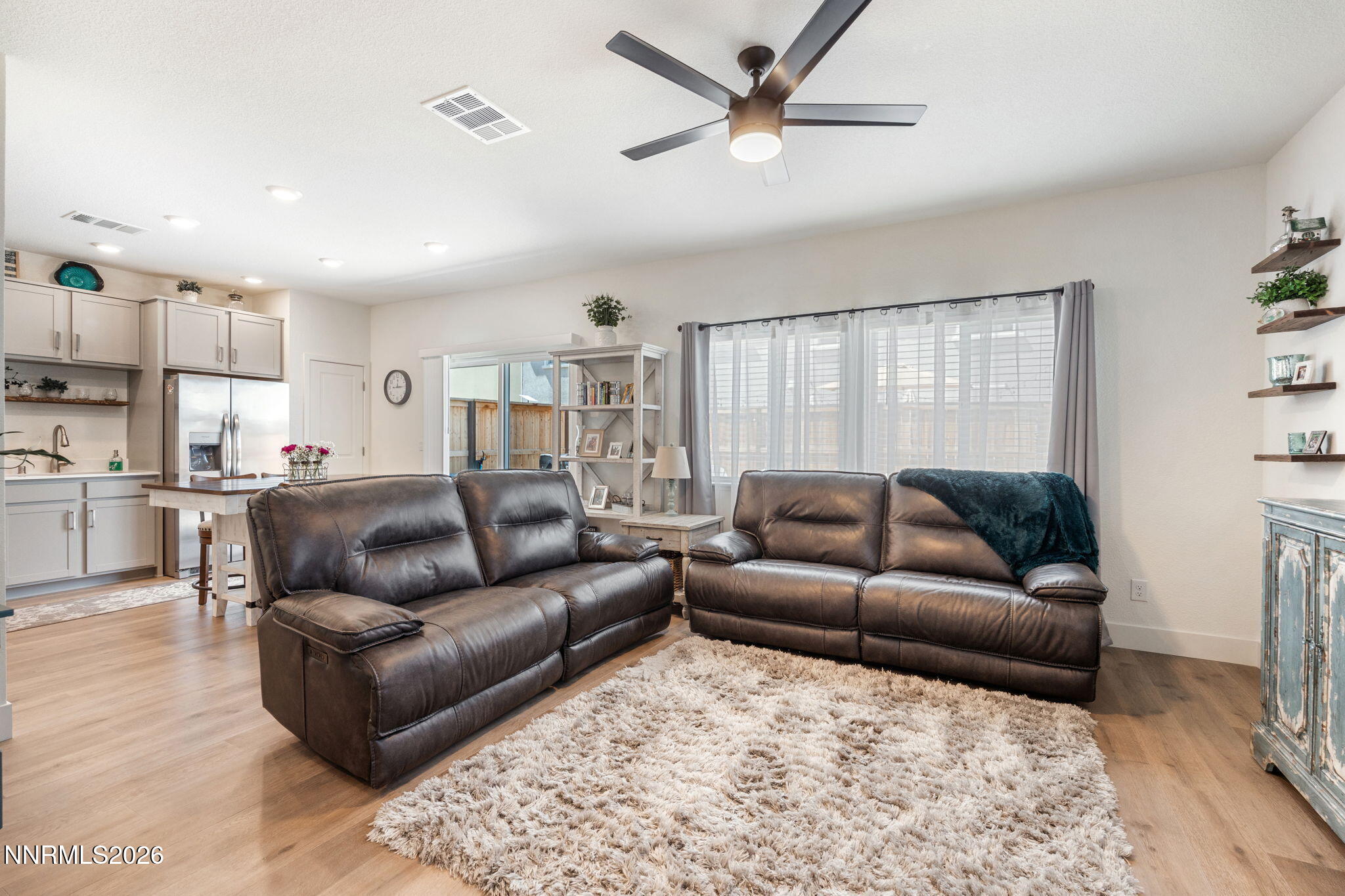 7999 Majorite Way Sparks, NV 89436 - Photo 6 of 26 a living room with furniture and a view of kitchen