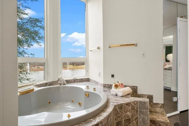 a bathroom with a tub and sink