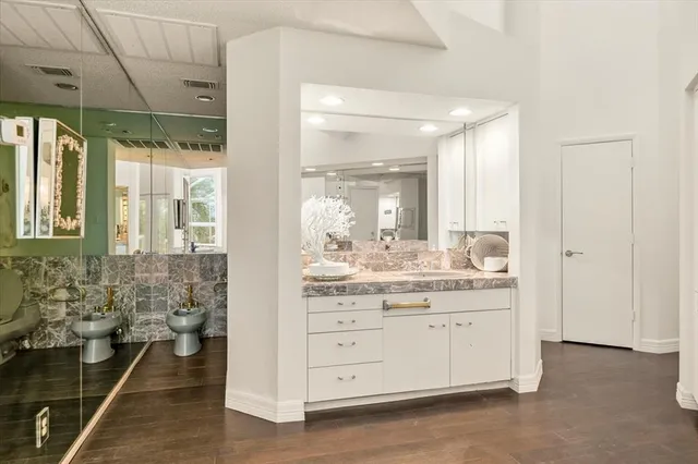 a bathroom with a double vanity sink and a mirror