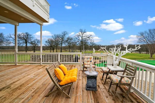a view of a balcony with furniture