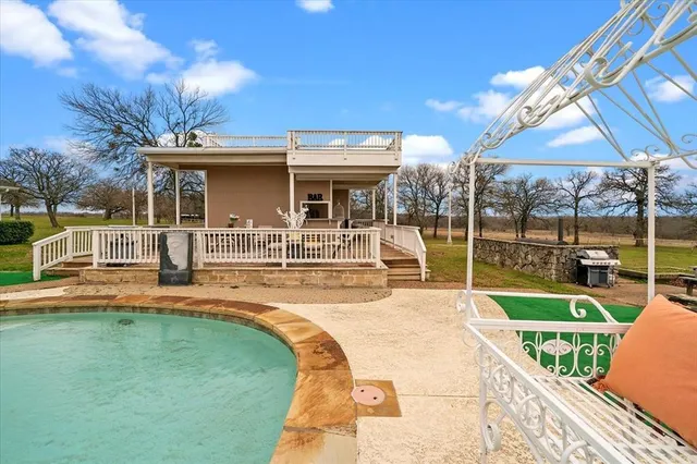 a view of a house with a swimming pool