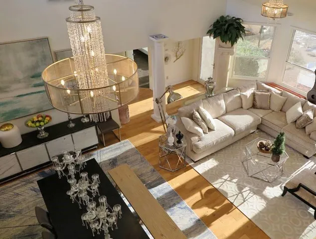 a living room with furniture and flowers