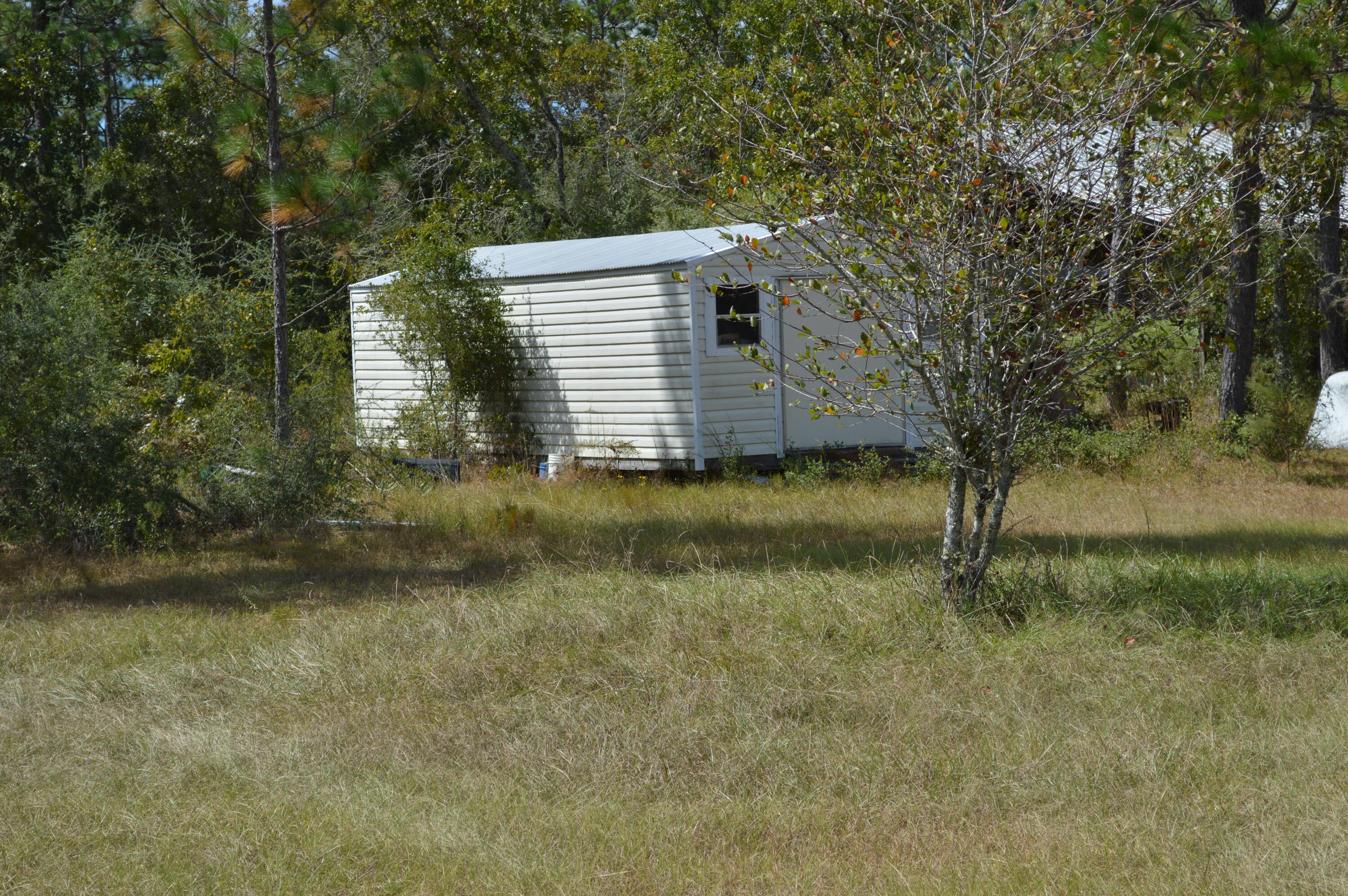 902 Bailie Road Crestview, FL 32539 - Photo 22 of 34 a view of a house with a yard