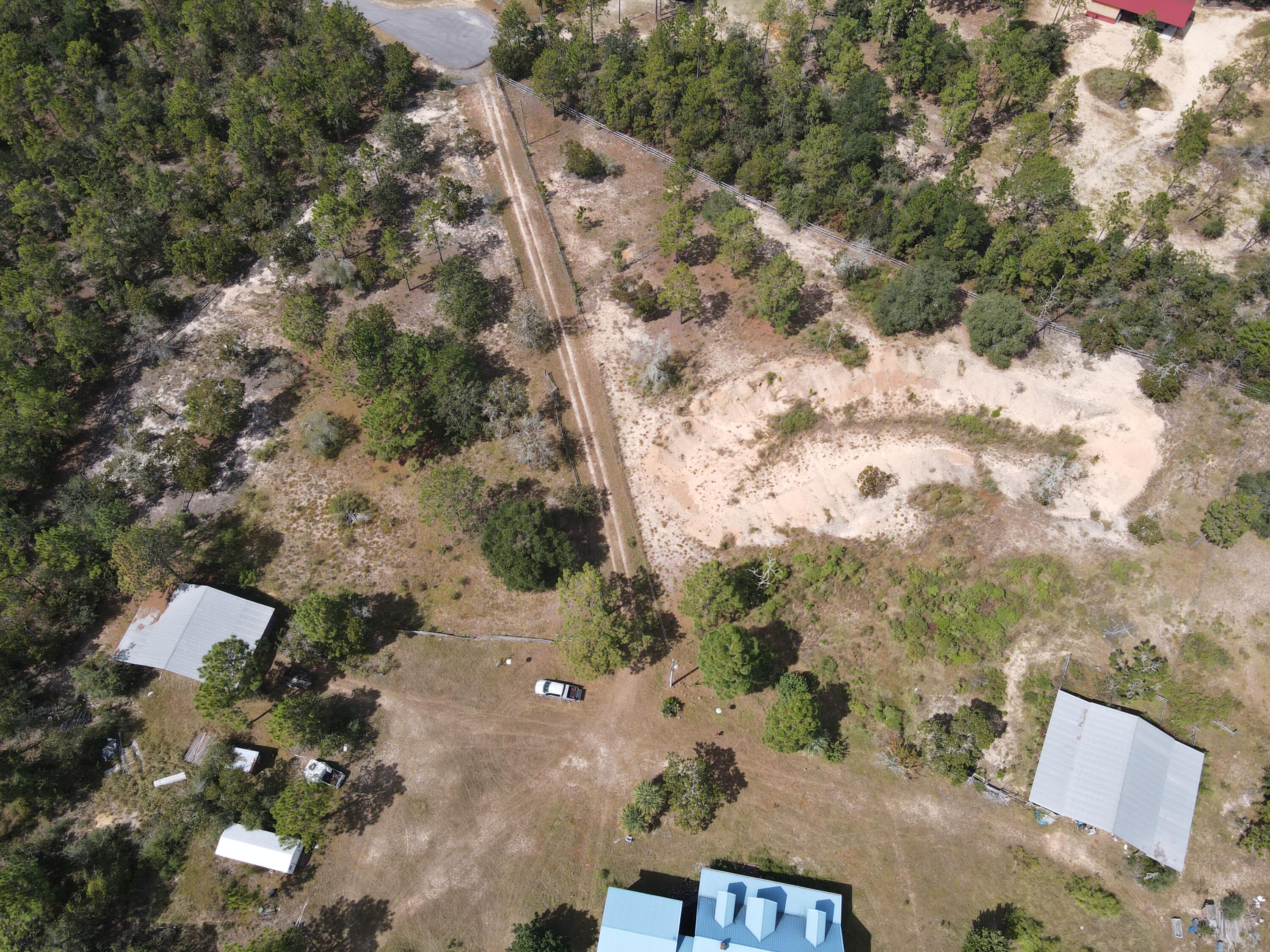 902 Bailie Road Crestview, FL 32539 - Photo 31 of 34 an aerial view of house with yard and mountain view