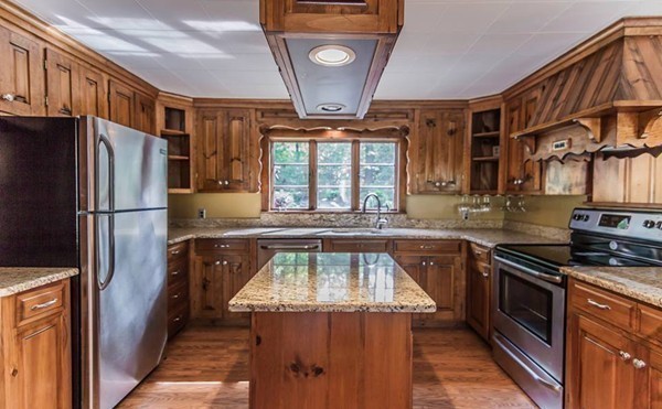 131 Shore Road Sturbridge, MA 01566 - Photo 13 of 29 a kitchen with a sink stainless steel appliances a window and a counter top space