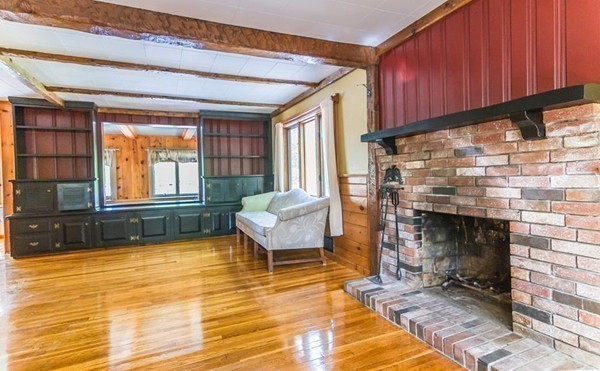 131 Shore Road Sturbridge, MA 01566 - Photo 20 of 29 a living room with furniture and a fireplace