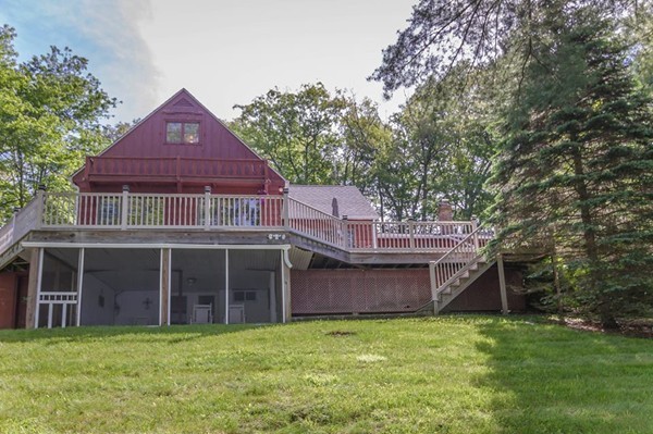 131 Shore Road Sturbridge, MA 01566 - Photo 2 of 29 a view of a house with a yard and sitting area