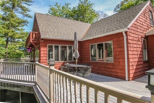 131 Shore Road Sturbridge, MA 01566 - Photo 5 of 29 a view of house with wooden deck and furniture