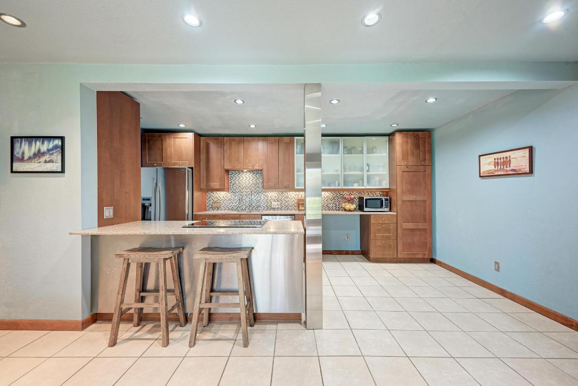 8210 Bent Tree Road, Unit 138 Austin, TX 78759 - Photo 11 of 24 a kitchen with a sink cabinets and window